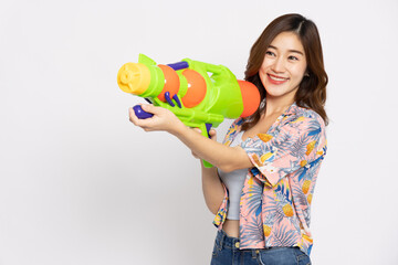 Young Asian woman in summer outfits holding water guns plastic for Songkran festival in Thailand isolated on white background - 756579728