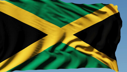 Close-up of the national flag of Jamaica flutters in the wind on a sunny day