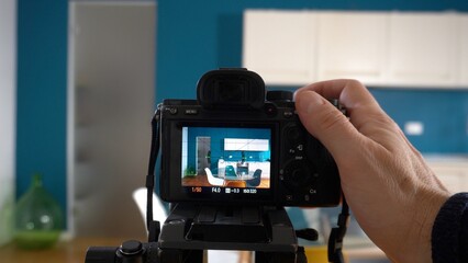 Real estate photographer taking pictures and videos  at house  in apartment living room with...