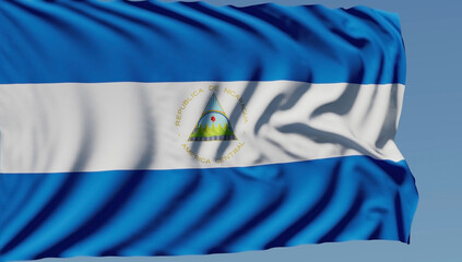 Close-up of the national flag of Nicaragua flutters in the wind on a sunny day