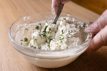 Dill is added to sour milk cheese