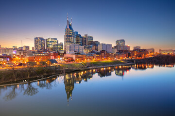 Nashville, Tennessee, USA. Cityscape image of Nashville, Tennessee, USA downtown skyline with reflection of the city the Cumberland River at spring sunset. - 756590177