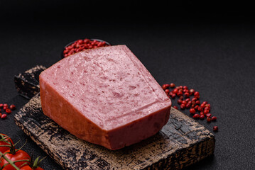 Delicious canned pink ham with salt, spices and herbs