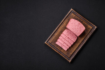 Delicious canned pink ham with salt, spices and herbs