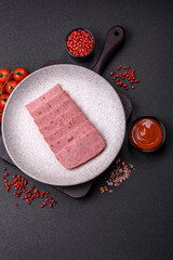 Delicious canned pink ham with salt, spices and herbs