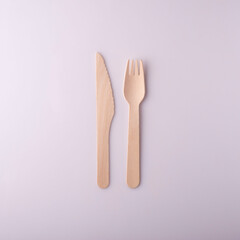 wooden knife and fork disposable eco-friendly tableware on a white background