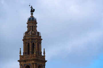 Fototapeta na wymiar The tower of Saint Peter's church against the sky, in Carmona