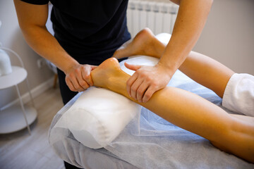 Professional Massage Therapist Working on Lower Body