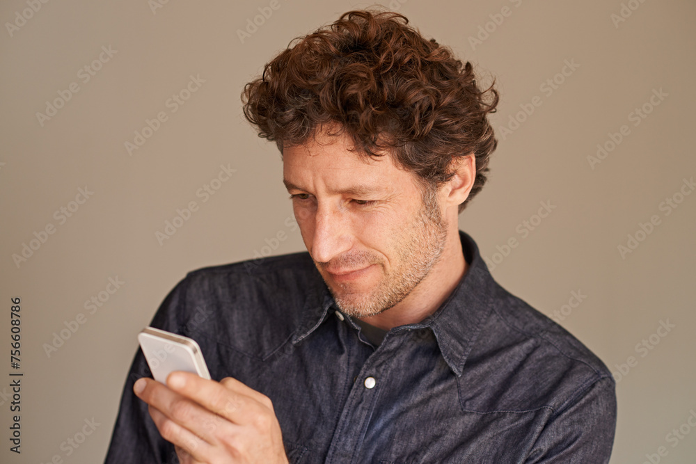 Aufkleber mature man, smartphone and texting in studio for thinking, reading or scroll for search on web by ba