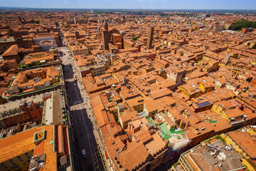 Bologna, Italy, 05.18.2018 - skyline from Asinelli tower, Two Towers, Due Torri. Buildings, tiled roofs and streets of Bologna. Italian red city.