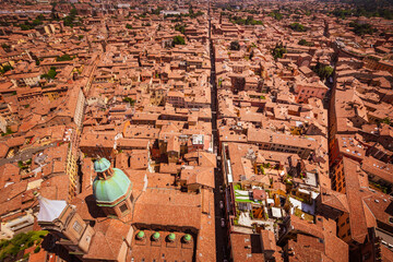 Roofscape, tiled roofs and streets of Bologna. Italian red city. Mediterranean cityscape. Beautiful view.
