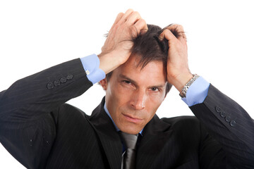 Stressed male executive in a suit showing signs of frustration a