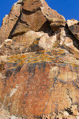 Explore ancient rock paintings of the steppe regions. Learn about the history and culture of petroglyphs. Discover the unique symbols and stories depicted in the artwork.