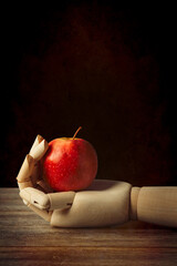 Wooden Hand With Apple