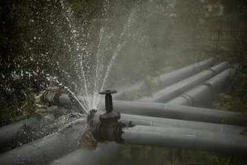 Burst pipe. Water pouring. Pipeline accident. It's dangerous situation.