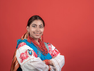 hispanic girl dressed in cayambe costume happy on red background