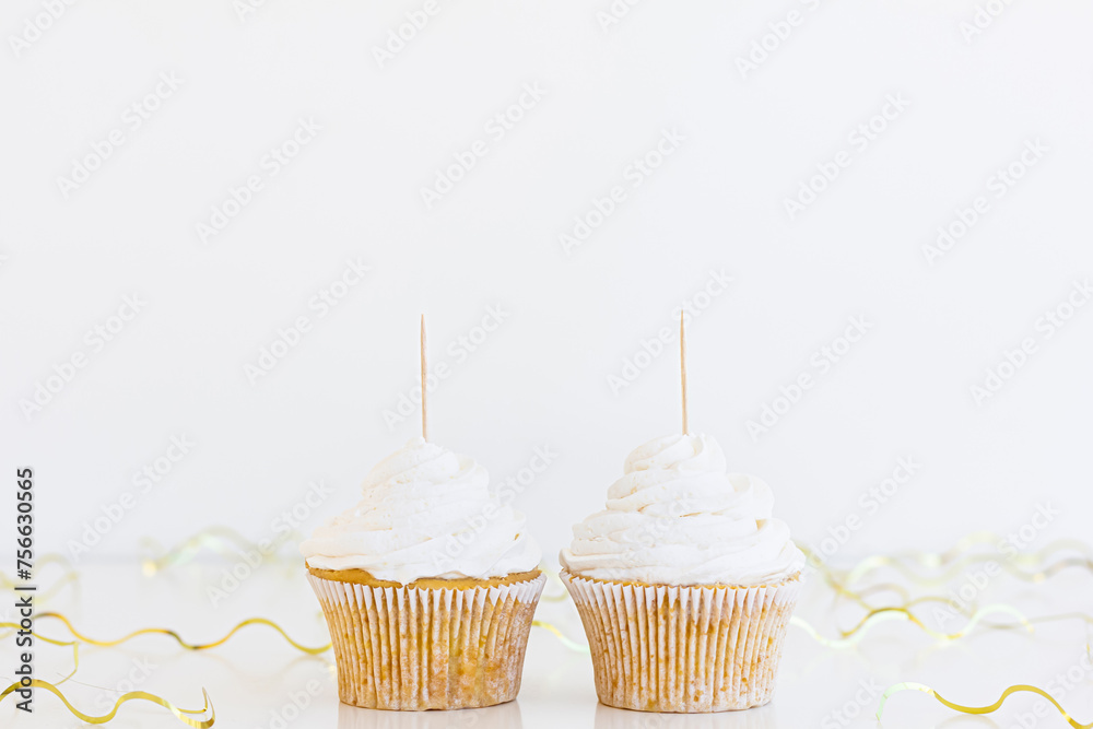 Wall mural two white cupcakes topper mockup. styled against a white background with gold confetti, ribbons . 2 