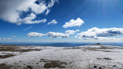 Serra da Estrela Natural Park (Portugal) covered in snow with silhouettes of people in the background