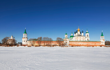 Panorama of the architectural ensemble of the Spaso-Yakovlevsky Monastery on a sunny winter day. View from the snow-covered Lake Nero. Rostov Veliky, Russia - 756633762