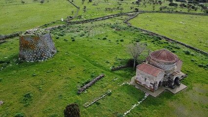 Nuraghe Santa Sabina in Silanus in central Sardinia with the church of Santa Serbana next to it.