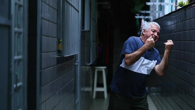 Jubilant Energetic Senior Man Dancing carefree , Smiling 70s Person Celebrating Life