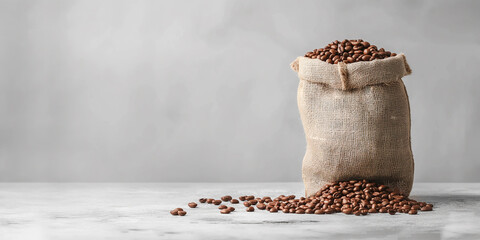 Brown roasted coffee beans of the best quality in a natural sack. Freshly roasted caffe beans, cafeteria and restaurant copy space background.