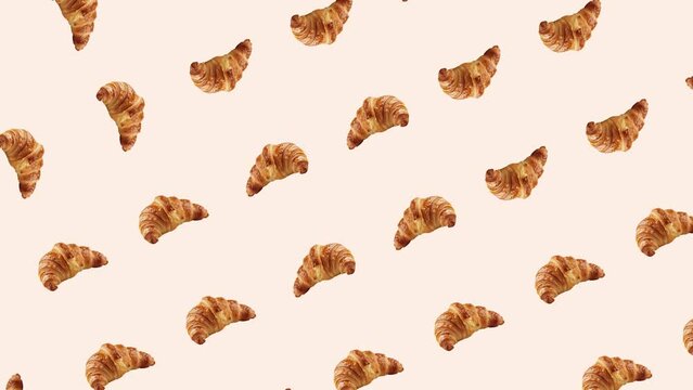Pattern of Golden Croissants on Pink Background