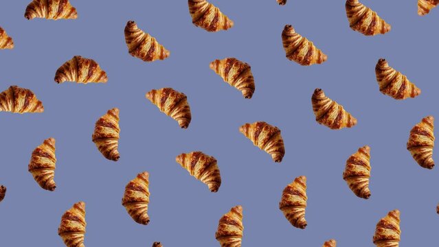 Seamless Pattern of Golden Croissants on Blue Background