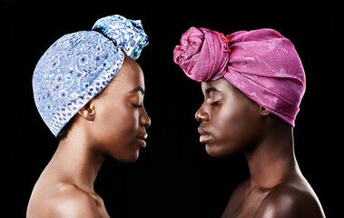 Studio, sisters and black women with skincare for beauty, profile and head wrap for aesthetic. Dark background, African female people and glow with shine of face, cosmetics and dermatology results