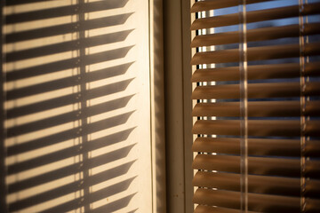 Blinds on the window. Interior details. Light through glass.