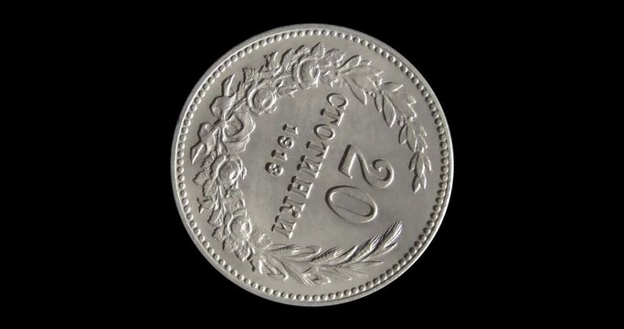 Reverse of Bulgaria coin 20 stotinki 1912, isolated in black background. Seamless animation in 4k resolution video.
