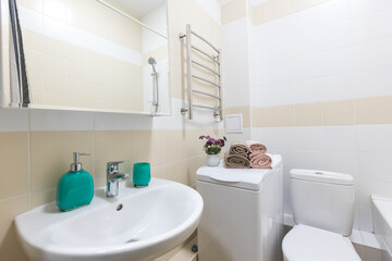 Fototapeta na wymiar modern bathroom room with toilet and washing machine