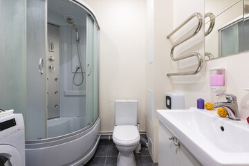 modern bathroom room with toilet and washing machine