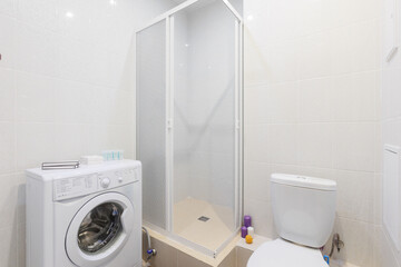 modern bathroom room with toilet and washing machine