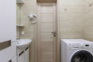 modern bathroom room with toilet and washing machine