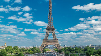 Champ de Mars and the Eiffel Tower timelapse in a sunny summer day. Paris, France
