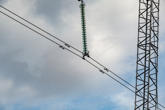 High Voltage Electric Power Grid Poles with Ceramic Insulators at Transformer Substation with Corona discharge