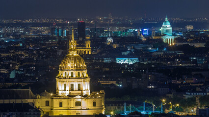 Aerial Night timelapse view of Paris City and Les Invalides shot on the top of Eiffel Tower