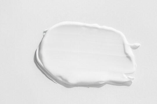 large smears of white cosmetic cream. The texture of the cream close up.