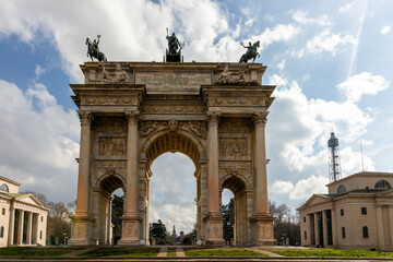 Fototapeta na wymiar Arco della Pace (Arc of Peace) In Milan, Italy, a Triumphal arch with bas-reliefs and statues, built by Luigi Cagnola at the request of Napoleon