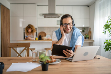One man caucasian male freelancer work from home on laptop computer