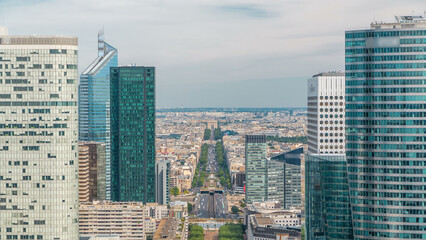 Fototapeta premium Aerial view of Paris and modern towers timelapse from the top of the skyscrapers in Paris business district La Defense