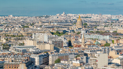 Fototapeta na wymiar Aerial panorama above many houses rooftops in a Paris timelapse