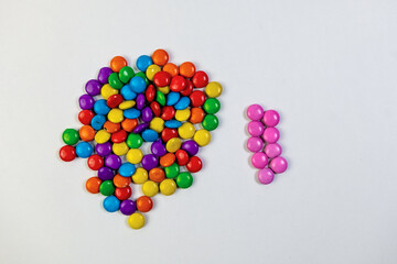 Colorful candies in the shape of a brain on white background