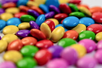Fototapeta na wymiar Colorful chocolate candies background, macro shot.jpg