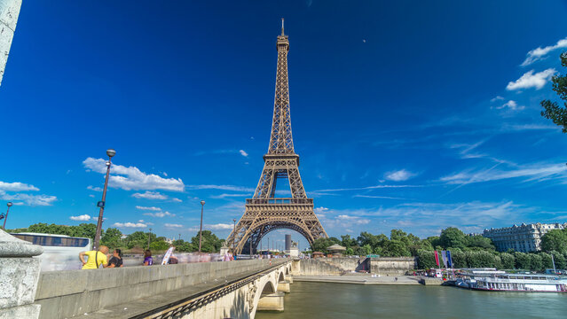 Eiffel Tower with bridge over Siene river in Paris timelapse hyperlapse, France