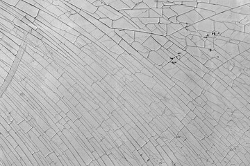 Cracked and weathered dry surface texture.