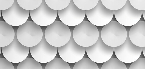 Create a minimalistic pattern with a repeating circular shape in shades of gray