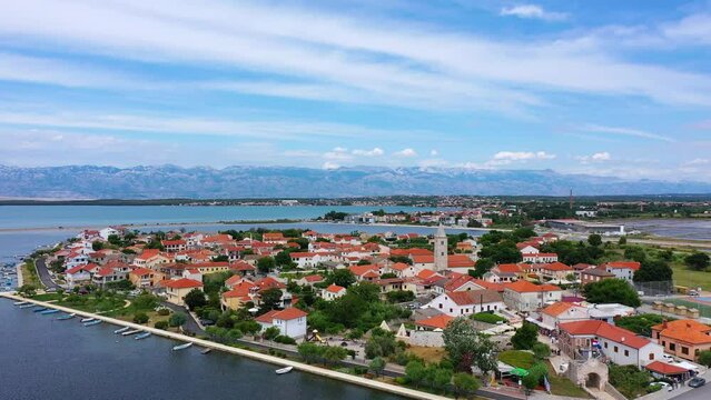 Historic town of Nin laguna aerial view with Velebit mountain background, Dalmatia region of Croatia. Aerial view of the famous Nin lagoon and medieval in Croatia