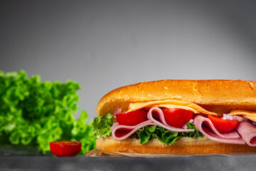 ham sandwich sliced meat, cheese, lettuce, tomato, vegetable, bun bread fresh food tasty eating meal food snack on the table copy space food background rustic top view